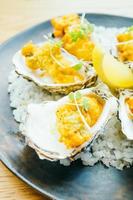 Fried oyster shell with sauce photo