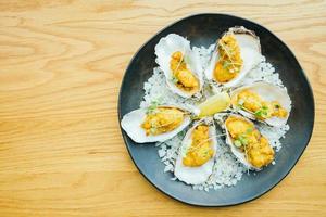 Fried oyster shell with sauce photo