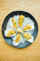 Fried oyster shell with sauce photo