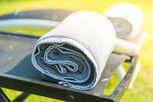 Towel on bed at the pool photo