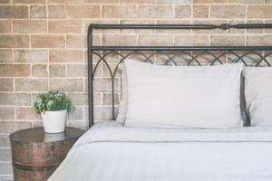 Pillows on bed decoration in bedroom interior photo