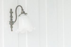 Vintage lantern on wall photo