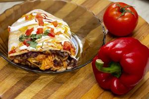 Close-up on a juicy burrito from a Mexican meal photo