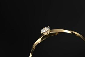 Section of gold diamond ring isolated on black background with copy space, 3D rendering photo