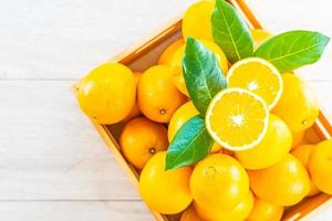 Fresh oranges fruit on table photo