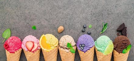 Flat lay ice cream cones collection on dark stone background photo
