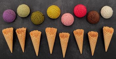 Various of ice cream flavors on dark stone background photo