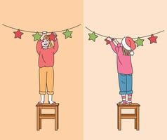 Cute children are standing on the chairs and decorating them for Christmas. hand drawn style vector design illustrations.