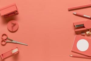 Composition of stationery supplies in pink color photo