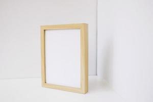 Wooden frame in the corner of neutral room