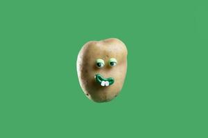 Funny potato with cute sticker on green background