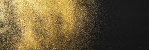 Golden glitter black background photo