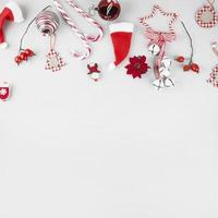 Christmas toys with candy canes on white background
