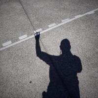 Man's shadow silhouette on the ground photo