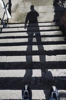 Man's shadow silhouette on the ground photo