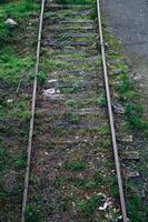 Railroad track in the station, train mode of transportation photo