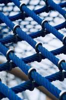 Blue rope net in the playground photo