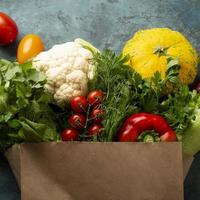 Groceries bag with vegetables photo