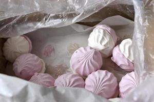 Pink and white marshmallow close up in a box photo