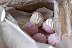 Pink and white marshmallow close up in a box photo