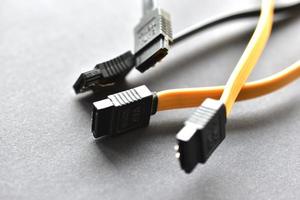 Computer hard drive plugs on black background photo