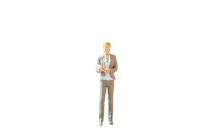 Miniature people, businesswoman standing on white background with clipping path photo
