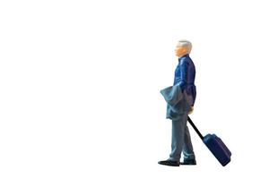 Miniature people, businessman with luggage on white background with clipping path photo