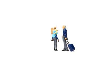 Miniature people, happy family standing on a white background and copy space for text photo