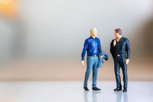Miniature people, gay couple standing together and copy space for text, LGBT concept photo