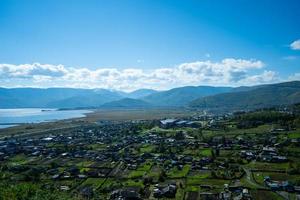 Aerial panorama of the village of Kultuk with a clear blue sky in Russia photo