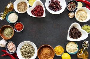 Frame of bowls of spices and herbs photo