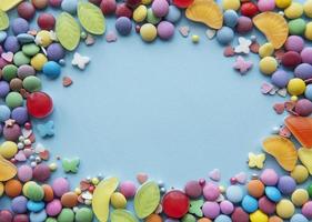 Frame of candy on a blue background photo