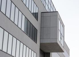 Large gray concrete structure with empty windows photo