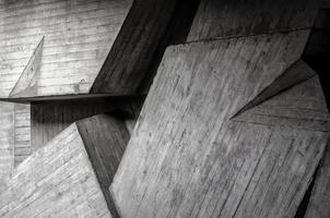 La trama de fondo abstracto de la estructura de la pared del edificio de hormigón gris con sombra foto