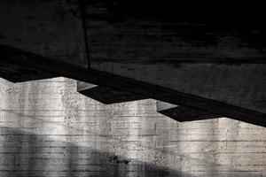 Abstract background of gray concrete building wall structure with shadow photo