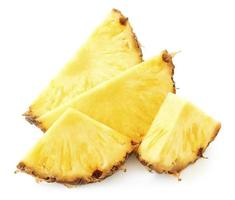 Heap of pineapple slices isolated on white background