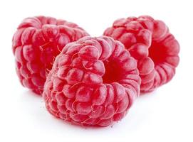 Fresh raspberry fruits isolated on white background photo