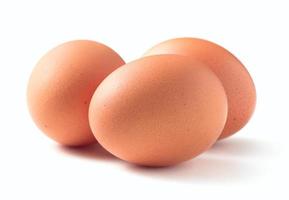 Raw chicken eggs isolated on white background photo