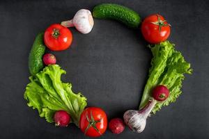 Fresh vegetables on a dark background. The concept of healthy nutrition and diet. photo