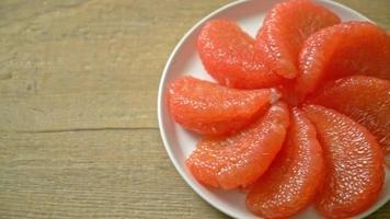 Fresh Red Pomelo Fruit or Grapefruit on Plate video