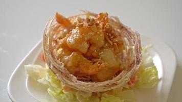 Fried shrimp with salad and fried taro basket topped by salad cream and mayonnaise video