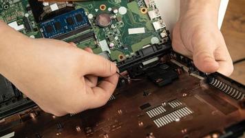 Laptop repair, examination of the computer in the service center. photo