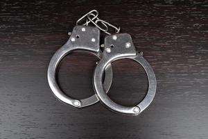 Handcuffs on the table, arrest imprisonment.