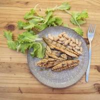 Grilled mackerel with salad and beans photo