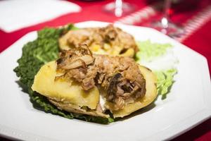 Potatoes stuffed with cabbage on a plate photo