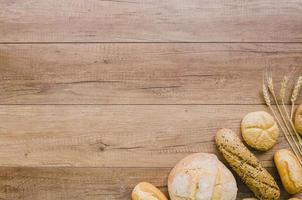 Bakery still life with handmade bread on wooden background photo