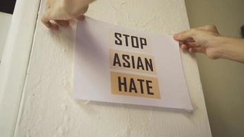 Stop Asian Hate Sign Attached to The Wall video