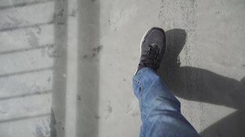 Walking on concrete floor. First person point of view. video