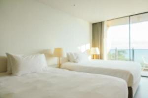 Abstract blur defocused hotel bedroom interior photo