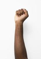 Black person holding fist up photo
